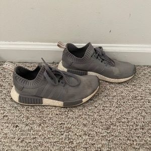 gray Adidas NMD sneakers